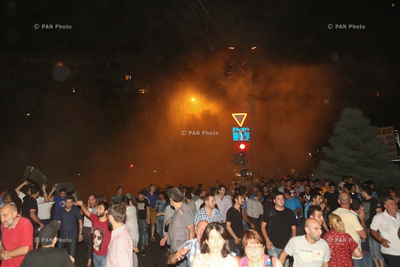 Tear gas fired, clashes between police and protesters near Yerevan's seized police department