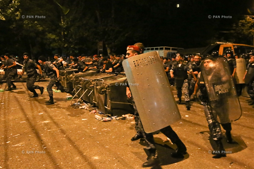 Police detain protesters outside seized patrol regiment in Yerevan